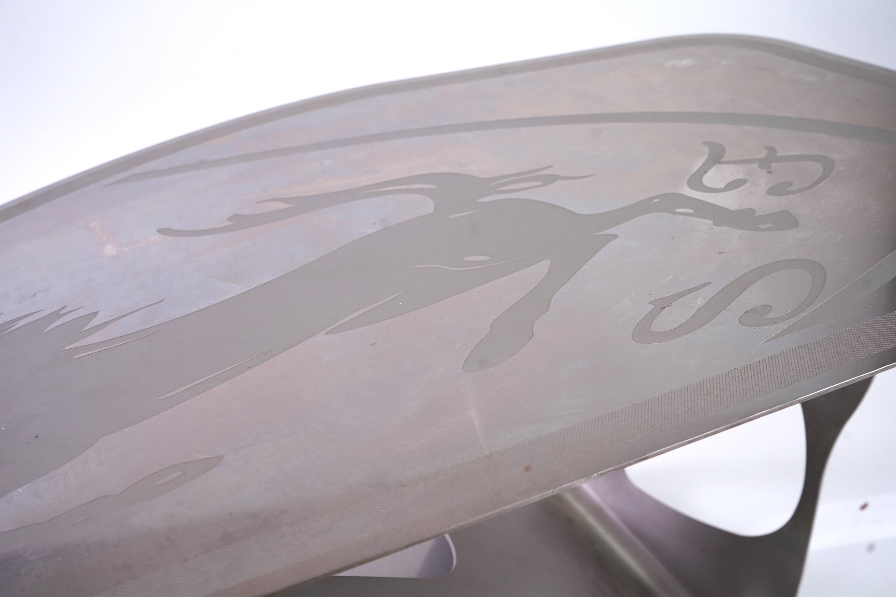 Pietro Psaier (Italian 1939-2004) A Ferrari polished steel coffee table, 1 of 3, in homage to Carlo Mollino